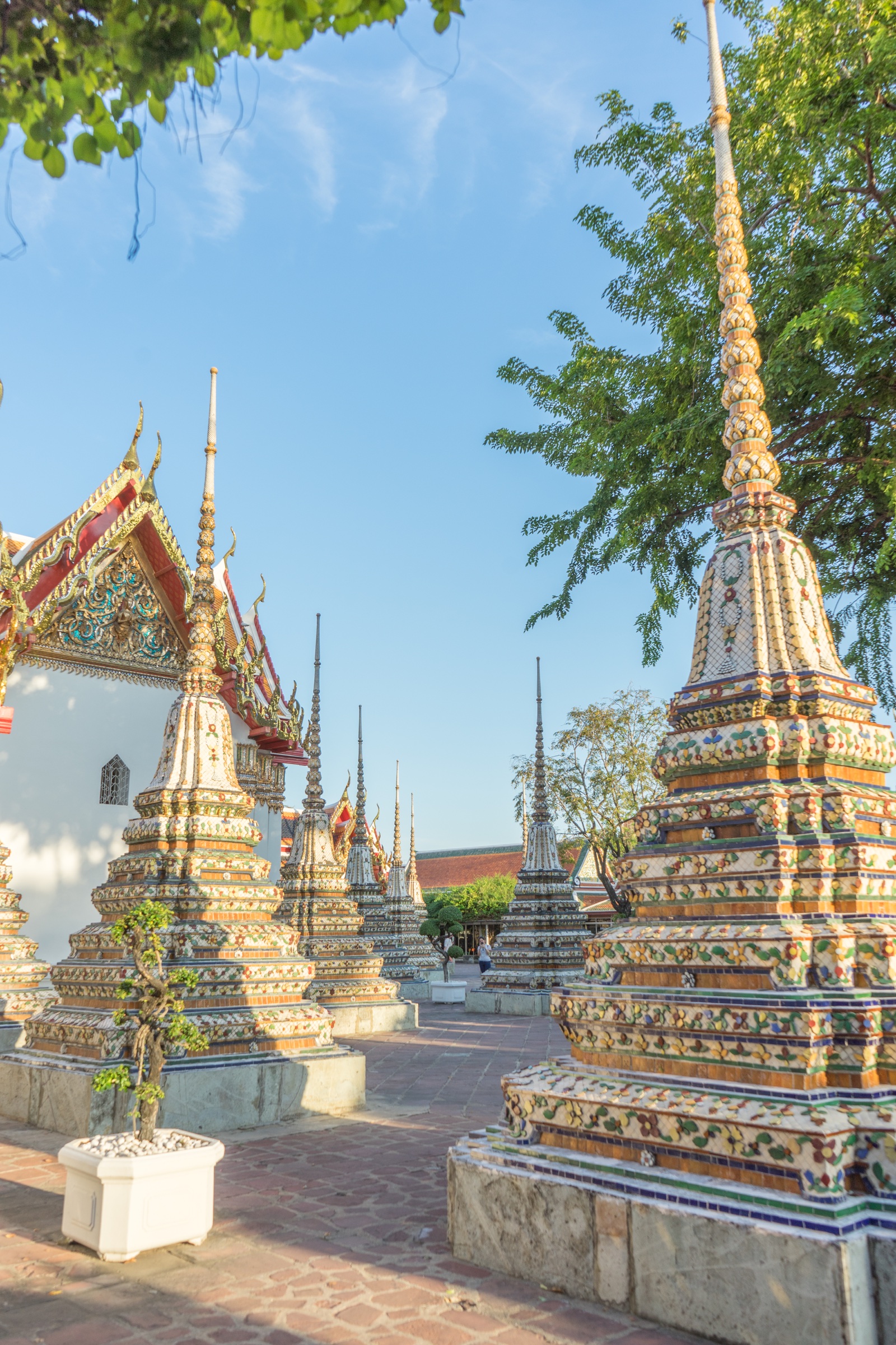 Ornate temple stupas beneath a bright blue sky